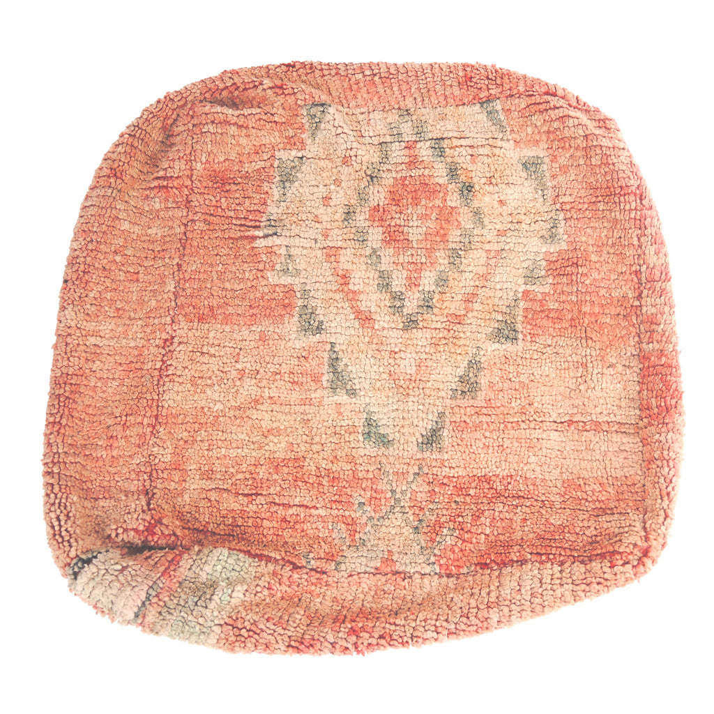 Vintage Moroccan floor cushion with neutral colors.