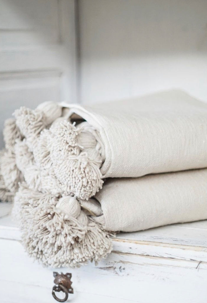 Pompom blanket, a charming addition to Moroccan rugs in Australia.