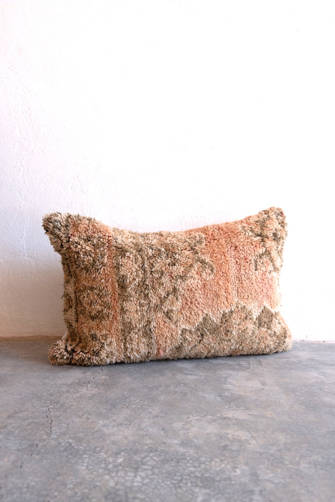 Vintage Moroccan pillow  with neutral colors and tribal patterns. sustainable recycled 