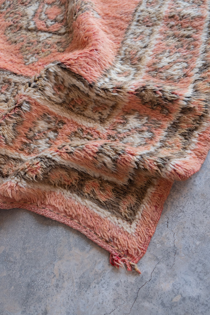 Vintage Moroccan rug  featuring elegant tribal patterns and neutral hues.