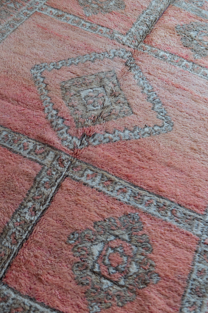 Vintage Moroccan rug  showcasing traditional Berber motifs.