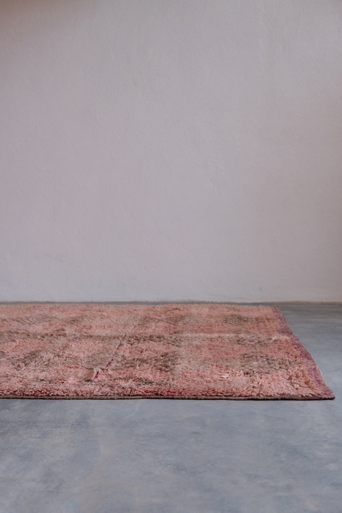 Vintage Moroccan rug  with tribal patterns, perfect for Moroccan interiors.