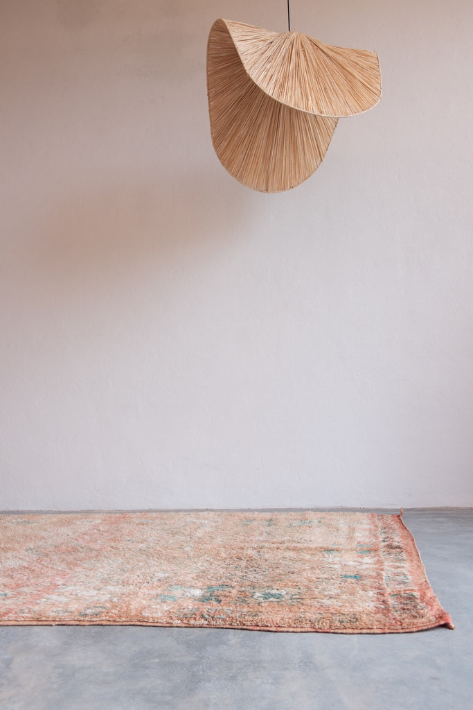 Vintage Moroccan rug featuring traditional Berber motifs and contemporary elements.
