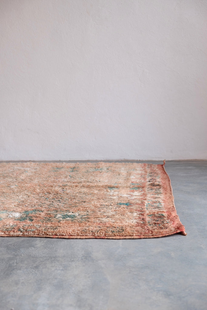 Vintage Moroccan rug with contemporary tribal motifs and neutral colors.