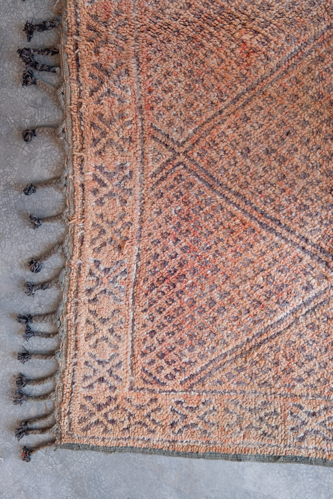 Vintage Moroccan rug  with tribal designs, perfect for Moroccan interiors.