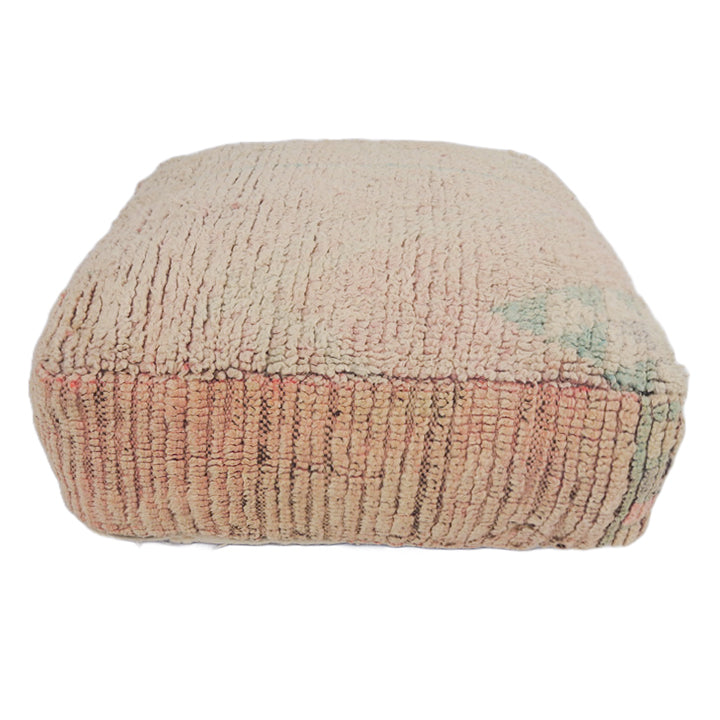 Vintage Moroccan floor cushion in faded pink. 