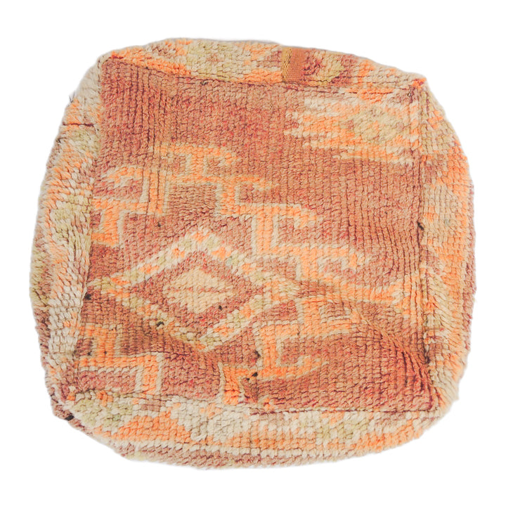 Vintage Moroccan floor cushion with tribal patterns.